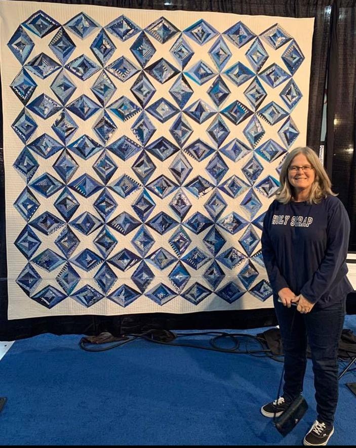 Blue Diamond Stars quilt — a striking geometric pattern with deep blue diamond star blocks